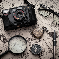 camera, map, compass