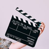 hand with clapboard